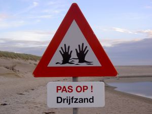 Quicksand_warning_sign_Texel_2004